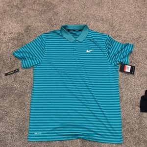 Brand New. Nike polo golf shirt. Size Large.